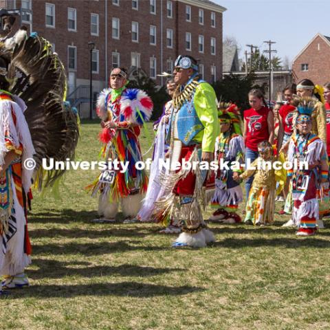 Members of UNITE (at right) dance in the circle during an intertribal portion of the powwow. 2022 UNITE powwow to honor graduates (K through college). Held April 23 on the greenspace along 17th Street, immediately west of the Willa Cather Dining Center. This was UNITE’s first powwow in three years. The MC was Craig Cleveland Jr. Arena director was Mike Wolfe Sr. Host Northern Drum was Standing Horse. Host Southern Drum was Omaha White Tail. Head Woman Dancer was Kaira Wolfe. Head Man Dancer was Scott Aldrich. Special contest was a Potato Dance. April 23, 2023. Photo by Troy Fedderson / University Communication.